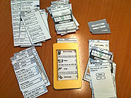 Photo of paper mockups of iphone screens with custom holder